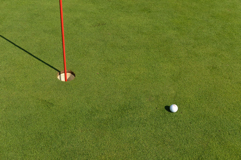 High angle view of ball on field at golf course