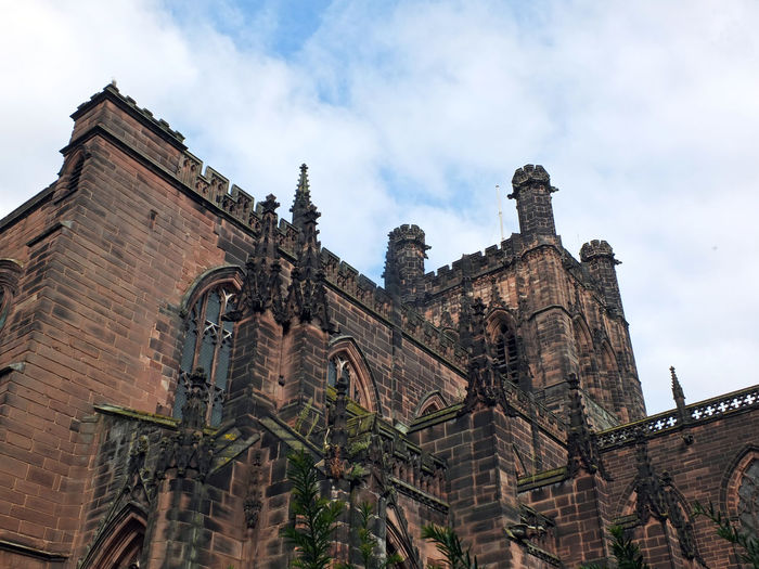 Close up view of ornate medieval stonework and tower on the historic chester cathedral