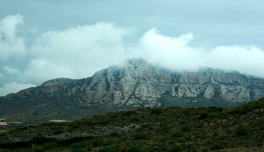 Mountain with clouds on top. landscape just before the rain