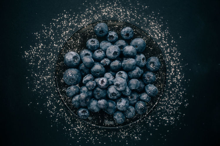 High angle view of blueberries in bowl