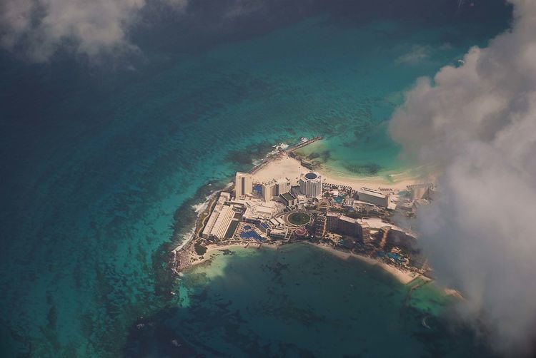 Aerial view of city by sea