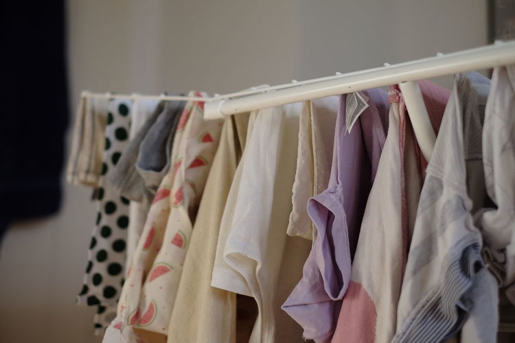 Close-up of clothes hanging in rack