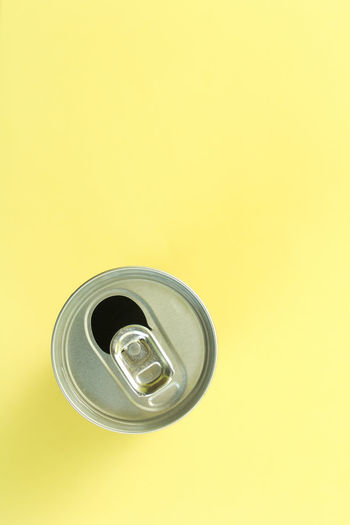 High angle view of drink against yellow background