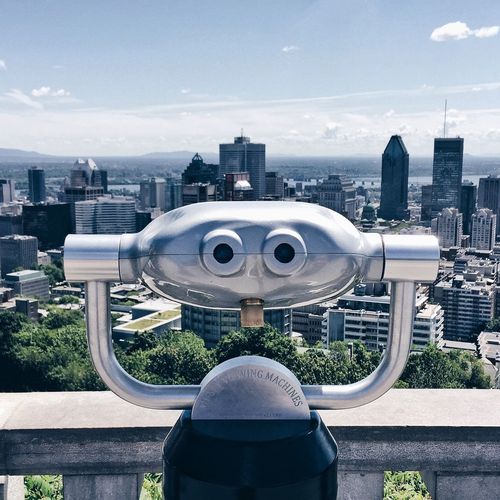Binoculars overlooking cityscape