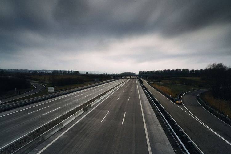 High angle view of highway against cloudy sky