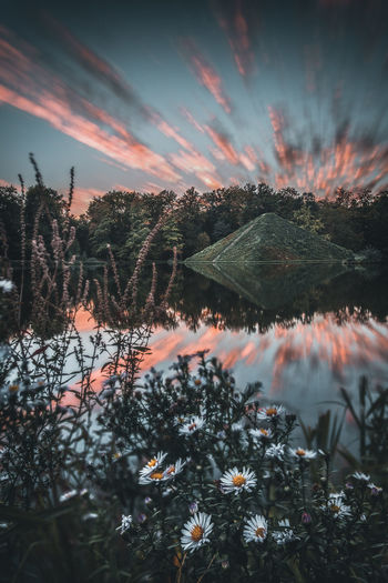 Scenic view of lake against sky during winter