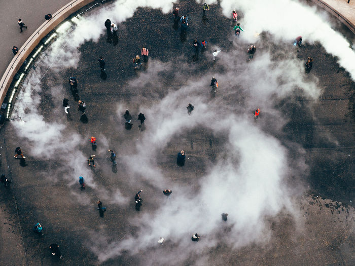 High angle view of people at town square during foggy weather