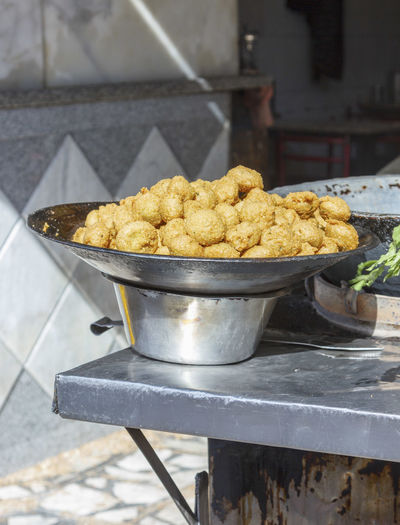 Vadas in container at market stall for sale