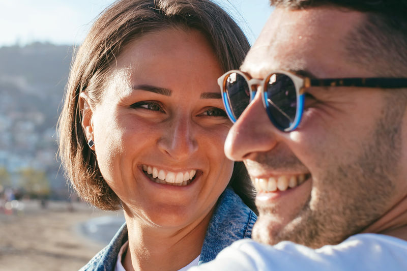 Happy portrait couple in love on the beach. family. diverse couple on summer vacation. 