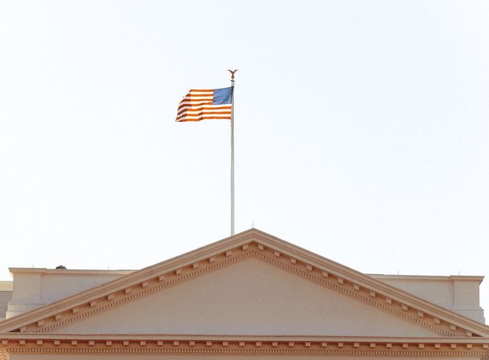 High section of white house building with american flag