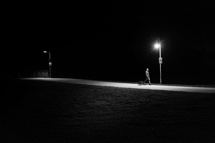 Person walking in the dark