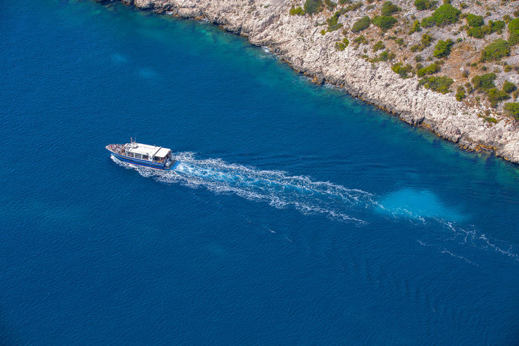 Crossing boat on the blue waters of the mediterranean in the calanques national park