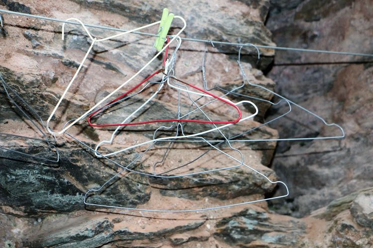 High angle view of ropes on rock