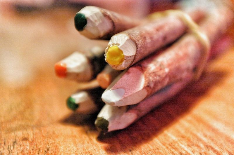 Close-up of colorful pencils bunch on table