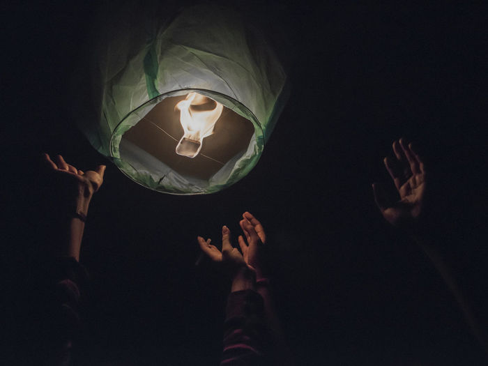 Low angle view of burning lantern mid-air