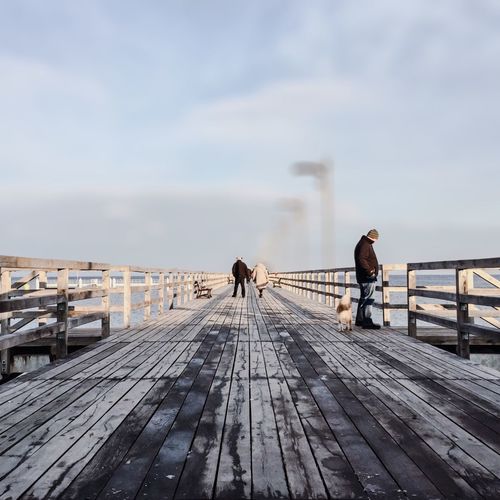Man walking on pier