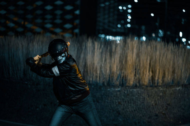 Halloween inspired cosplay of a bandit swinging baseball bat