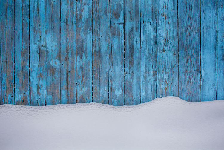 Snow on wooden wall