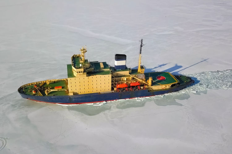 High angle view of ship sailing in sea during winter