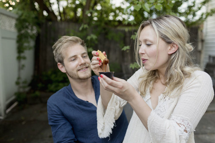Couple eating churros together