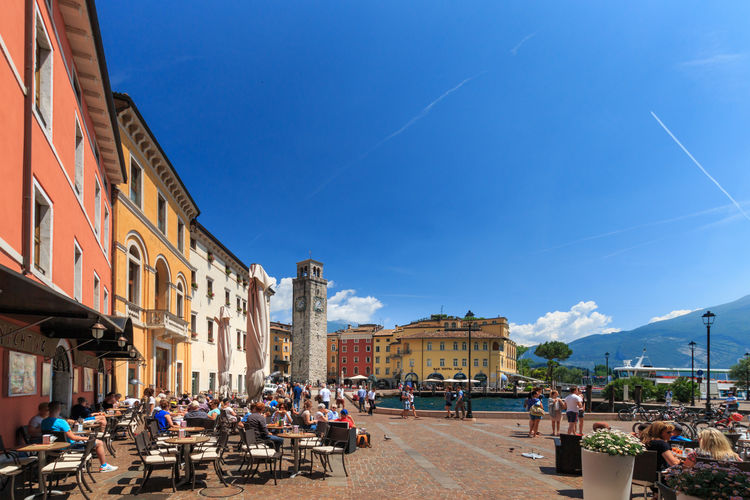 Riva del garda, italy, may 25, 2017. old town and piazza iii novembre against blue sky