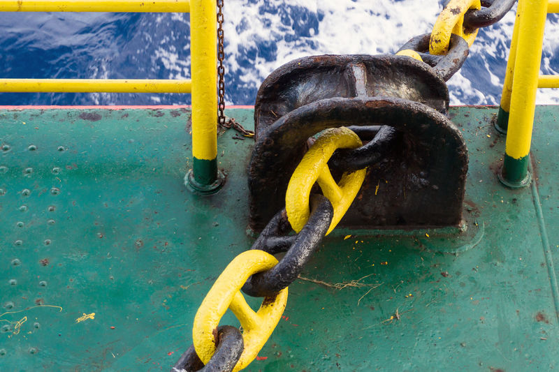 Mooring chain of a construction work barge secured to panama choke