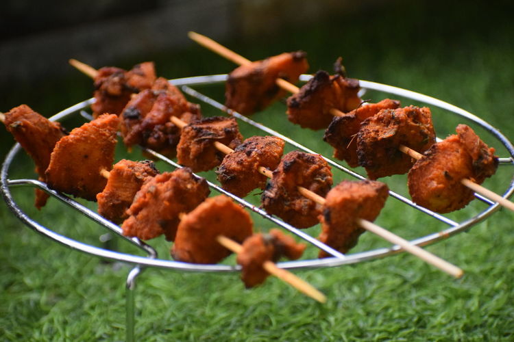 Closeup view of grilled chicken arranged in rows
