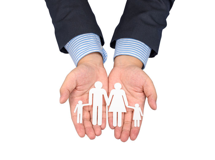 Low section of person standing against white background