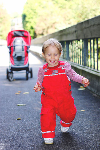 Portrait of boy standing on road