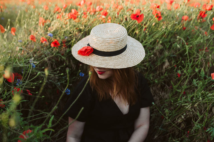 Woman wearing hat on field