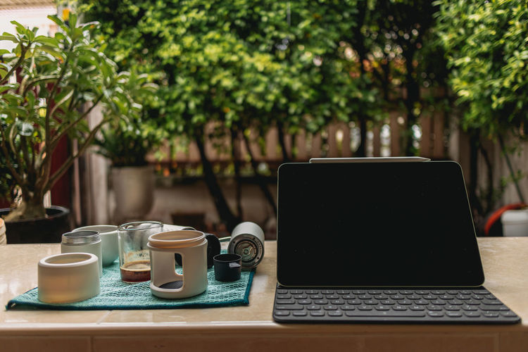 Coffee and laptop on table