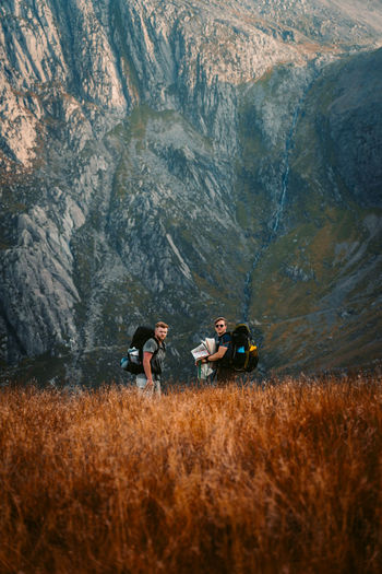 PEOPLE ENJOYING ON MOUNTAIN