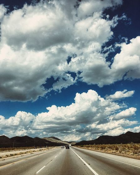 View of road against cloudy sky