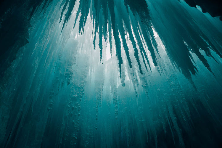Low angle view of icicles in cave