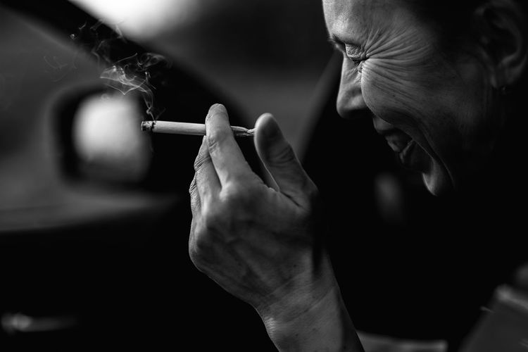 Close-up of man smoking
