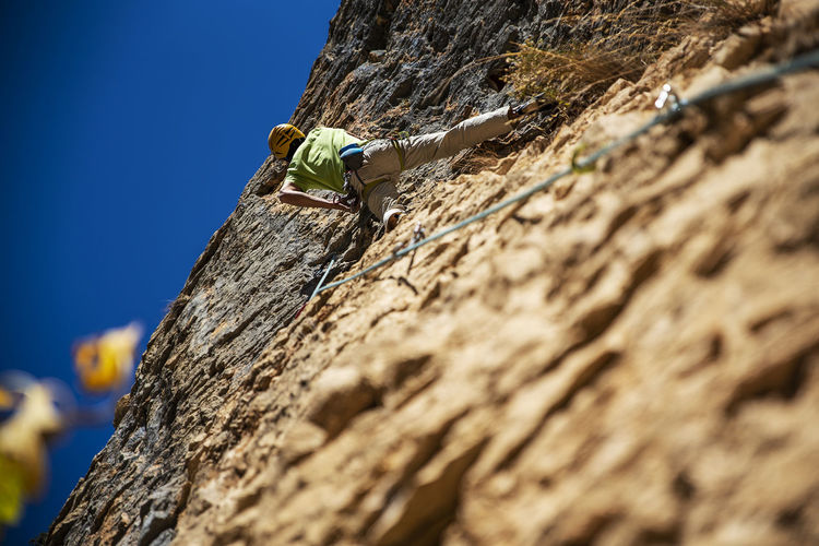 Low angle view of rope on rock