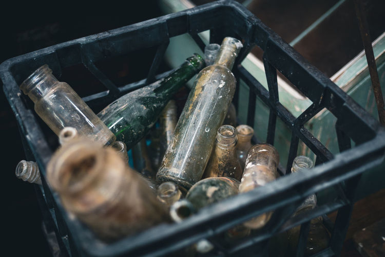 Old bottles in a container 