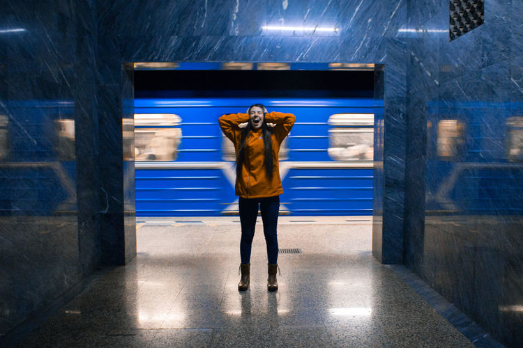 Woman standing at subway station