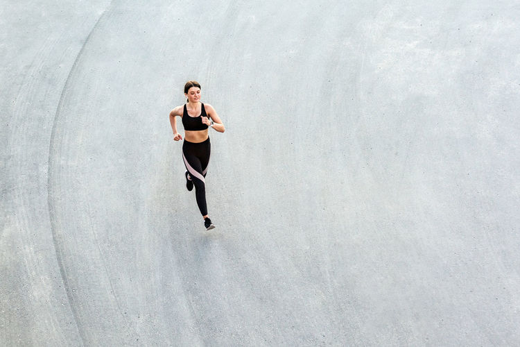 High angle view of teenage boy running