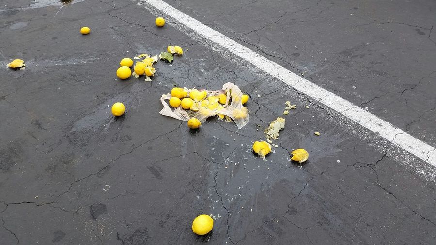 Squashed lemons on road