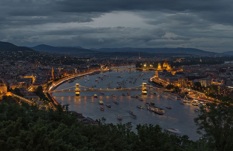 High angle view of szechenyi chain bridge over danube river in city at dusk