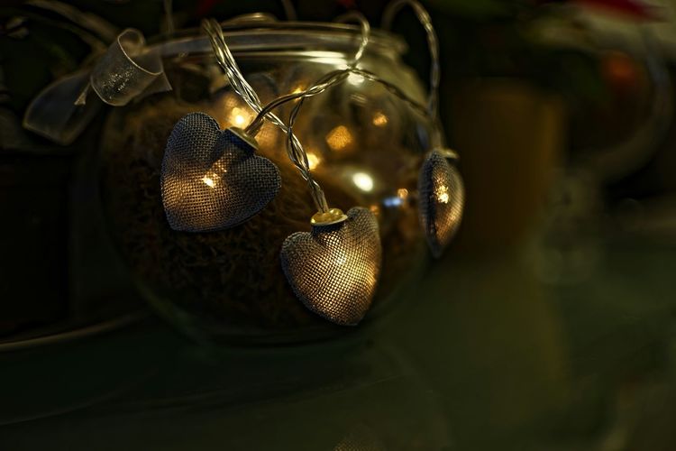 Close-up of lighting equipment hanging on table