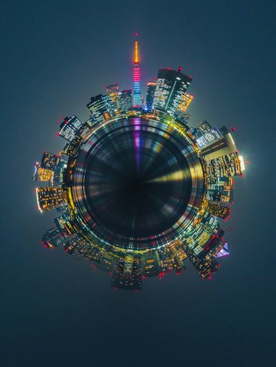 Digital composite image of illuminated building against sky at night