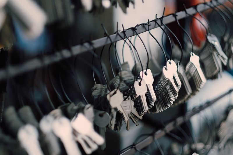 Close-up of keys hanging on railing