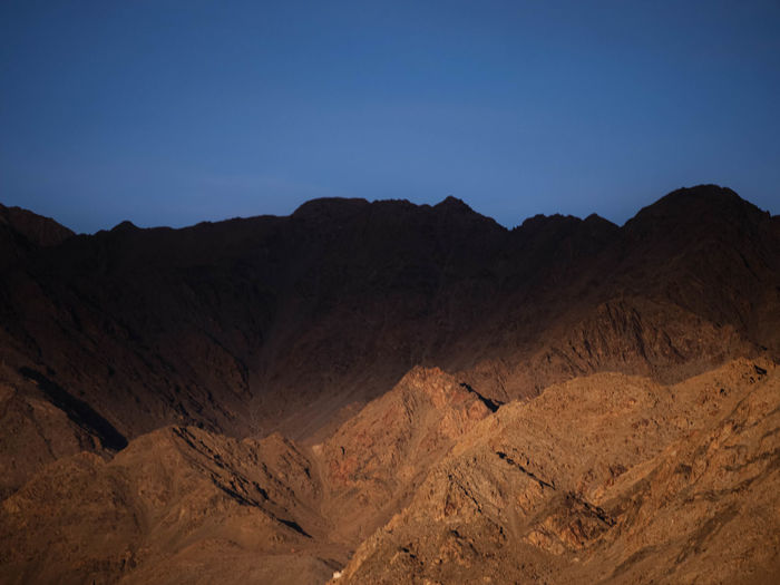 Scenic view of mountains against clear sky