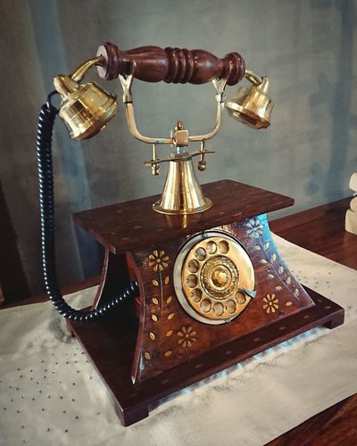 Close-up of telephone booth on table