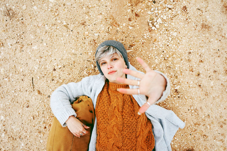 One Person Young Adult Adult Front View Holding Leisure Activity Casual Clothing Clothing Waist Up Day Three Quarter Length Sport Portrait Women Lifestyles Hat Human Arm Contemplation