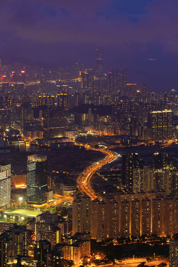 High angle view of illuminated buildings in city at night