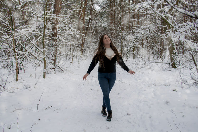 Full length of woman on snow field