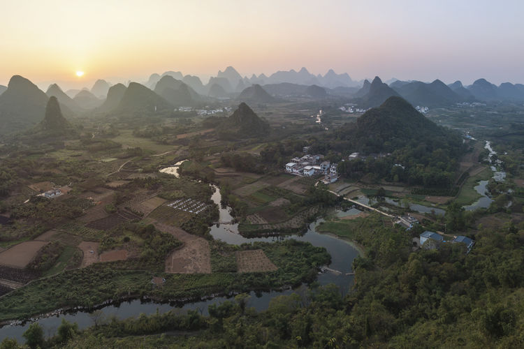 Scenic view of mountains against sky during sunset